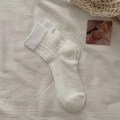 White ballet style knit socks featuring hollow floral patterns and ribbed cuffs - One Size / White