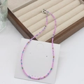 Pink and blue bohemian beaded necklace with golden accents on a jewelry card - Pink Blue Gold (23)