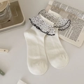 Cream white ribbed socks with black and white polka dot lace ruffles for a sweet Lolita style - Bleached White