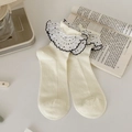 Sweet cream white socks with black polka dot lace ruffles and vertical ribbed texture - Creamy White