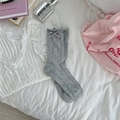 Grey pointelle knit crew socks with satin bow detail in a cozy lifestyle setting - One Size / Gray