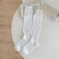 White Japanese JK style knee-high socks featuring ruffle trim and delicate ribbon bows - One Size / White