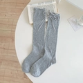 Light gray knit knee-high socks with ruffled edges and sweet bow ribbon details - One Size / Gray