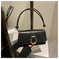 Detail of black leather flap crossbody bag with gold U-shaped buckle and knot strap - Black