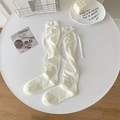 White ballet-style calf socks featuring elegant silk ribbons and sweet bow details - Creamy White