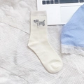 Creamy white crew socks featuring grey dog silhouette with a 3D white ribbon bow - Beige Grey Dog (Ribbon Bow)