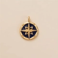Close-up of golden compass pendant with blue enamel star and engraved cardinal directions - Octagram Eight-Pointed Star Pendant