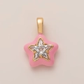 Macro shot of gold star pendant with pink enamel border and clear zircon stone - Pink Flower Pendant