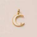 Detail of a gold crescent moon charm with white enamel and a hanging pearl bead - Enamel Moon Pendant