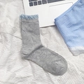 Light gray crew socks with light blue ruffled cuffs and delicate bow pattern design - Blue Bubble Mouth (A104-5)