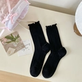 Sweet black mid-calf socks with ruffle trim and vertical stripe texture for women - One Size / Black