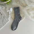 Grey knit mid-calf socks with delicate white bows and breathable pointelle mesh patterns - One Size / Korean Gray