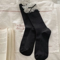 Elegant black crew socks with white polka dot lace trim and delicate ribbon bow detail - One Size / Black