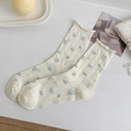 Off-white cotton crew socks with blue floral pattern and ruffled edges in a soft aesthetic - One Size / White Floral