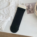 Calze lavorate a maglia nere maculate con doppi polsini a volant color crema chiaro - Taglia unica / Nero