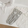 Grey knit crew socks with vertical ribs and lucky label on a soft white fabric - One Size / Full Grey