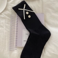 Black ribbed crew socks featuring a cream ribbon bow and vintage button accents - One Size / Black