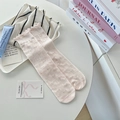 Pink crew socks with bow jacquard and ruffle cuff in a minimalist setup - One Size / Pink