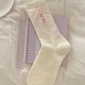 Cream knit mid-calf socks featuring pink ribbon bows and cute button accents - One Size / White