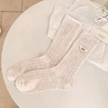 Creamy white ribbed mid-calf socks featuring a triangular patch and letter embroidery - One Size / Khaki