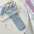 Light blue crew socks with bow jacquard pattern and elegant ruffled cuffs for women - One Size / Blue