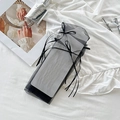 Elegant black organza mesh socks with ribbon bow tie, displayed with refined accessories - One Size / Black Thin Ribbon