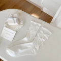 White ballet-style crew socks with ruffle trim and cute ribbon bows for women - White