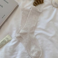 Beige ribbed mid-calf socks with delicate ruffle trim in a minimalist aesthetic - One Size / Khaki