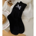 Japanese style black crew socks with white ruffled lace trim and striped bow accent - One Size / Black