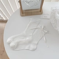 White crew socks with vertical rib texture and a delicate ribbon bow accent - One Size / Vertical Striped Style
