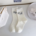 Calze bianche crema con motivo jacquard a cucciolo grigio e fiocco bianco in rilievo - Taglia unica / Bianco