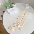 Japanese style off-white calf socks with ribbed knit details in a cozy home setting - Light Yellow