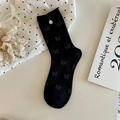 Sweet black crew socks with bow pattern and shell button detail in a retro aesthetic - One Size / Black