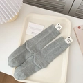Grey ribbed crew socks with a white heart label on a decorative tray - One Size / Light Gray