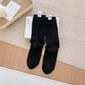 Klassische schwarze Rippensocken mit weißem Webetikett und blauem Smiley-Motiv für Damen - Einheitsgröße / Schwarz