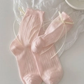 Pink ribbon bow crew socks with ribbed texture and wavy lace trim in a flat lay style - One Size / Pink