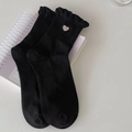 Sweet black crew socks with lace ruffle cuffs and pink heart embroidery detail - Black