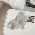 Gray knitted crew socks featuring light blue ribbed cuffs and a decorative woven label - Grey with Cloth Label