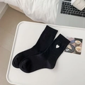 Black crew socks with silver glitter heart embroidery in a cozy lifestyle setting - Black Heart Pattern