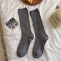 Grey ribbed knit slouch socks with eyelet mesh detail on white linen background - One Size / Medium Grey