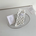 Polka dot crew socks in cream white with vintage textile label and black dots - One Size / White