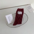 Polka dot crew socks in burgundy red with a stylish blue pattern and fabric label - One Size / Burgundy