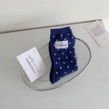 Navy blue polka dot cotton socks featuring white knit pattern and branded label - One Size / Navy Blue