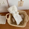 White Lolita calf socks featuring fluffy pom-poms and cute bow details in ribbed knit - One Size / White
