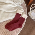 Thick wool socks in deep burgundy with white plush fold-over cuffs for winter warmth - One Size / Red