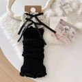 Jambières noires en tricot avec bordure en dentelle crème et nœud élégant - Taille unique / Noir