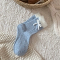 Light blue speckled knit socks with white faux fur trim and bow detail for winter - One Size / Blue