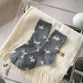 Dark grey cashmere knit socks featuring cute white dog pattern with ribbed cuffs - All-over White Dog Pattern