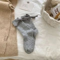 Cozy grey ribbed wool socks for women featuring a sweet bow detail on the heel area - One Size / Gray