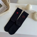 Black crew socks with heart embroidery and 'Follow your heart' text on white background - One Size / Black